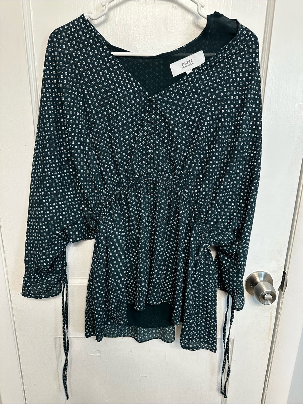 TEXTILE Elizabeth and James Black Printed Peplum Top